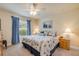 Bedroom featuring nautical decor, bright windows with blue curtains, and cozy carpet for a serene retreat at 406 Phillips Creek Ln, New Smyrna Beach, FL 32168