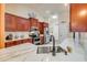 Kitchen features stainless appliances, quartz countertop and a breakfast bar at 406 Phillips Creek Ln, New Smyrna Beach, FL 32168