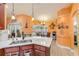Open kitchen overlooks the dining area, complete with a kitchen island and ample counter space at 406 Phillips Creek Ln, New Smyrna Beach, FL 32168