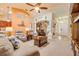 Spacious living room with high ceilings, comfortable seating, and a seamless flow into the kitchen at 406 Phillips Creek Ln, New Smyrna Beach, FL 32168