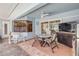 Covered patio space furnished with a dining table and chairs, offering a relaxing outdoor dining area at 406 Phillips Creek Ln, New Smyrna Beach, FL 32168