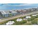 A scenic coastal aerial view featuring nearby condominiums and proximity to the beach at 4150 S Atlantic Ave # 111B, New Smyrna Beach, FL 32169