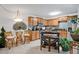Charming kitchen with wooden cabinets, stainless steel appliances, and a unique island with seating at 4150 S Atlantic Ave # 111B, New Smyrna Beach, FL 32169