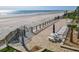 Beach access with seating area with beach views and lush landscape at 4155 S Atlantic Ave # 111, New Smyrna Beach, FL 32169