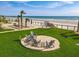 Enjoy the community outdoor seating area by the beach at 4155 S Atlantic Ave # 111, New Smyrna Beach, FL 32169