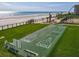 Aerial view of beach access, shuffleboard, and beautiful ocean at 4155 S Atlantic Ave # 111, New Smyrna Beach, FL 32169