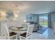 Charming dining area with seating for four and bright natural light at 4155 S Atlantic Ave # 111, New Smyrna Beach, FL 32169