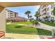 Well-maintained condo complex with lush landscaping and common lawn area at 4155 S Atlantic Ave # 111, New Smyrna Beach, FL 32169