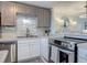 Modern kitchen with stainless steel appliances and a stylish backsplash at 4155 S Atlantic Ave # 111, New Smyrna Beach, FL 32169