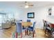 Open-concept dining area features a table, chairs, and a view of the water at 454 Bouchelle Dr # 202, New Smyrna Beach, FL 32169