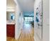 Inviting hallway leading into the condo with views of the living area and exterior at 454 Bouchelle Dr # 202, New Smyrna Beach, FL 32169