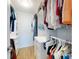 Spacious walk-in closet with custom shelving and storage for organizing clothes and accessories at 454 Bouchelle Dr # 202, New Smyrna Beach, FL 32169