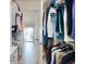 Walk-in closet with custom storage and a door leading to an outdoor balcony area at 454 Bouchelle Dr # 202, New Smyrna Beach, FL 32169