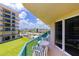Condo balcony with a table and chairs overlooking the manicured lawn at 4555 S Atlantic Ave # 4310, Port Orange, FL 32127
