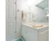 Well-lit bathroom featuring a white vanity with sink and cabinet space, along with towel racks at 4555 S Atlantic Ave # 4310, Port Orange, FL 32127
