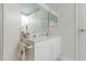 Bathroom with white vanity, tile floor, and a large mirror at 4555 S Atlantic Ave # 4310, Port Orange, FL 32127