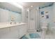 Bathroom with white vanity, enclosed shower, tile floor and fish themed décor at 4555 S Atlantic Ave # 4310, Port Orange, FL 32127