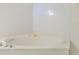 Cozy, tiled bathtub nook with a shell accent, perfect for relaxation at 4555 S Atlantic Ave # 4310, Port Orange, FL 32127