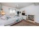 Relaxing bedroom with ceiling fan, carpeted floor, queen bed, dresser and book shelves at 4555 S Atlantic Ave # 4310, Port Orange, FL 32127