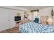 Spacious bedroom with balcony, carpeted floor, queen bed, and bright natural light at 4555 S Atlantic Ave # 4310, Port Orange, FL 32127
