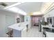 Bright kitchen featuring white cabinetry, stainless steel appliances, and an eat-in bar, perfect for casual dining at 4555 S Atlantic Ave # 4310, Port Orange, FL 32127