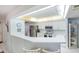 Spacious kitchen area with white cabinets, stainless steel appliances, and a breakfast bar, ideal for meal preparation and entertaining at 4555 S Atlantic Ave # 4310, Port Orange, FL 32127