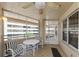 Enclosed patio offering seating with views of the building and surrounding landscape at 4555 S Atlantic Ave # 4310, Port Orange, FL 32127