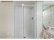 Bright bathroom showcasing a glass-enclosed shower with white tiles and modern fixtures at 4555 S Atlantic Ave # 4310, Port Orange, FL 32127