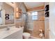 Elegant bathroom with tiled walls, glass-enclosed shower, and modern fixtures at 5146 Pineland Ave, Port Orange, FL 32127