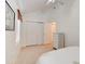 Neutral bedroom featuring a double closet, vaulted ceilings, and a light-colored dresser at 5146 Pineland Ave, Port Orange, FL 32127
