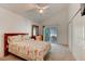 Bright bedroom featuring neutral carpet, vaulted ceiling, and a sliding glass door leading to an outdoor space at 5146 Pineland Ave, Port Orange, FL 32127