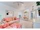 Bright living room featuring a cozy couch, charming decor, and ample natural light at 5146 Pineland Ave, Port Orange, FL 32127