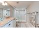 Modern bathroom with a spacious walk-in shower, sleek vanity, and towel warmer for added comfort at 5207 S Atlantic Ave # 224, New Smyrna Beach, FL 32169
