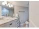 Bathroom with a stylish glass vessel sink, granite countertop, and modern fixtures at 5207 S Atlantic Ave # 224, New Smyrna Beach, FL 32169