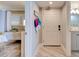 Inviting entryway to a bedroom and bathroom, enhanced by chic décor and tile flooring at 5207 S Atlantic Ave # 224, New Smyrna Beach, FL 32169