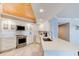 Bright kitchen featuring white cabinetry, quartz countertops, and modern stainless steel appliances at 5207 S Atlantic Ave # 224, New Smyrna Beach, FL 32169