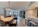 Open living space connects dining and kitchen with ample lighting at 5207 S Atlantic Ave # 224, New Smyrna Beach, FL 32169
