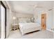 Serene main bedroom with a ceiling fan, soft lighting, and a private balcony at 5207 S Atlantic Ave # 224, New Smyrna Beach, FL 32169
