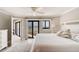 Spacious main bedroom with balcony access, offering stunning views and ample natural light at 5207 S Atlantic Ave # 224, New Smyrna Beach, FL 32169