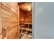 Cozy wood sauna interior with bench seating and a traditional sauna heater for relaxation at 5207 S Atlantic Ave # 224, New Smyrna Beach, FL 32169