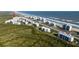 Aerial view showcasing the building's proximity to the beach and surrounding condos in Palm Coast at 5300 S Atlantic Ave # 5-502, New Smyrna Beach, FL 32169