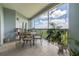 Covered balcony with seating offers a peaceful outdoor retreat with scenic views at 5300 S Atlantic Ave # 5-502, New Smyrna Beach, FL 32169