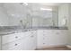 Bathroom with large vanity, dual sinks, ample counter space, and bright lighting at 5300 S Atlantic Ave # 5-502, New Smyrna Beach, FL 32169