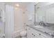 Clean bathroom with a shower, tub, modern vanity, and granite countertops at 5300 S Atlantic Ave # 5-502, New Smyrna Beach, FL 32169