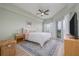 Serene bedroom with a view of the balcony, soft lighting, and plush bedding at 5300 S Atlantic Ave # 5-502, New Smyrna Beach, FL 32169