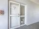 Apartment front door showing unit number 5502 and a sidelight window with blinds at 5300 S Atlantic Ave # 5-502, New Smyrna Beach, FL 32169
