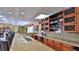 Community kitchenette with granite countertops, a sink, plenty of cabinet space, and adjacent dining area at 5300 S Atlantic Ave # 5-502, New Smyrna Beach, FL 32169