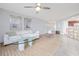 Cozy living room with a plush white sofa, a glass coffee table, and a jute rug at 5300 S Atlantic Ave # 5-502, New Smyrna Beach, FL 32169