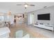 Bright living room featuring dining area, bar seating, and neutral decor for a cozy atmosphere at 5300 S Atlantic Ave # 5-502, New Smyrna Beach, FL 32169