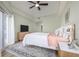 Serene main bedroom with plush bedding, soft colors, and a sliding glass door at 5300 S Atlantic Ave # 5-502, New Smyrna Beach, FL 32169